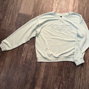 Divided Light Blue Shine Sweater